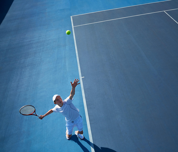 Tennis player taking a lesson with a club professional